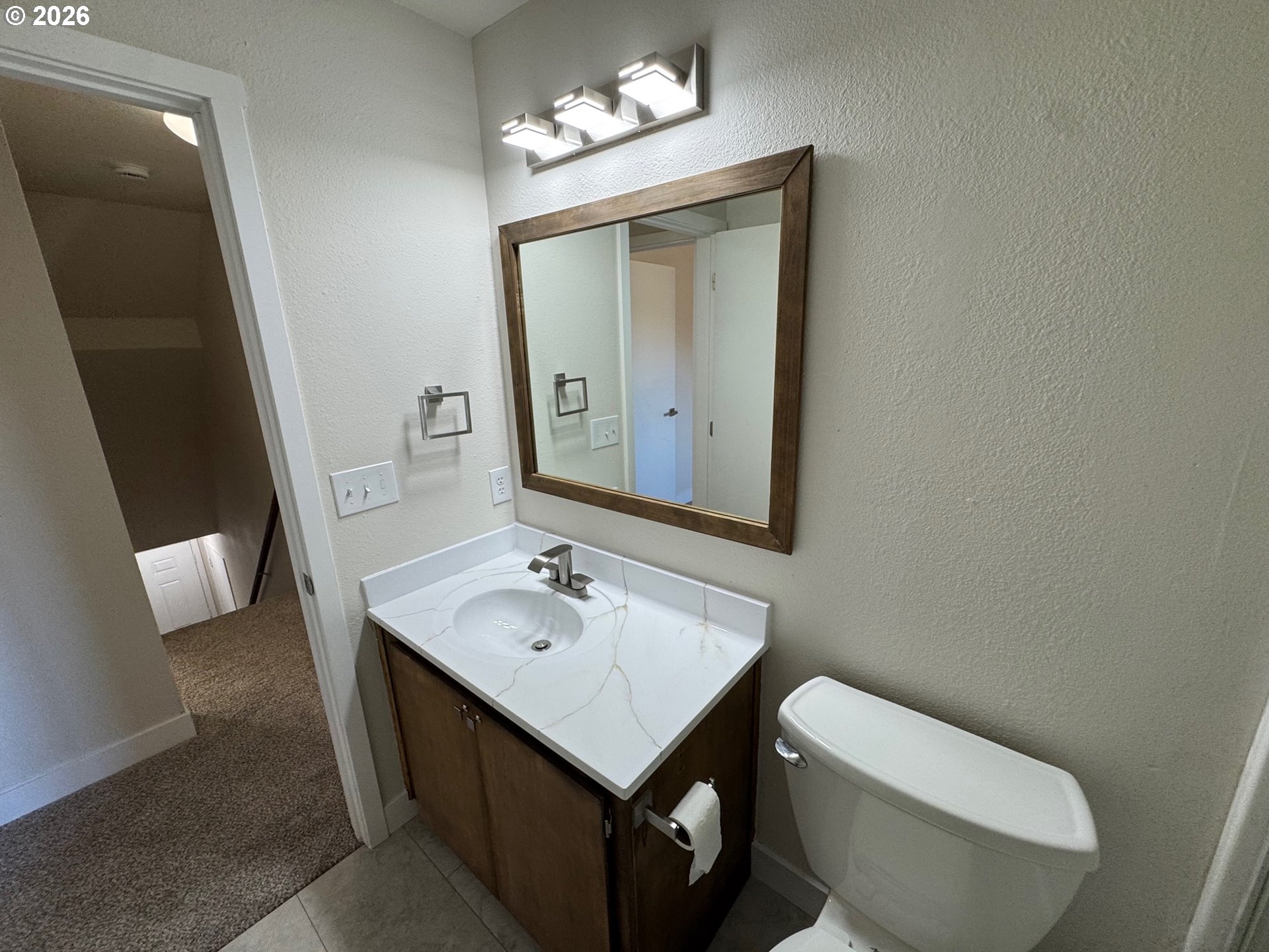 19901 Southwest Meadowbrook Court Beaverton, OR 97078 - Photo 19 of 23 a bathroom with a toilet sink and mirror