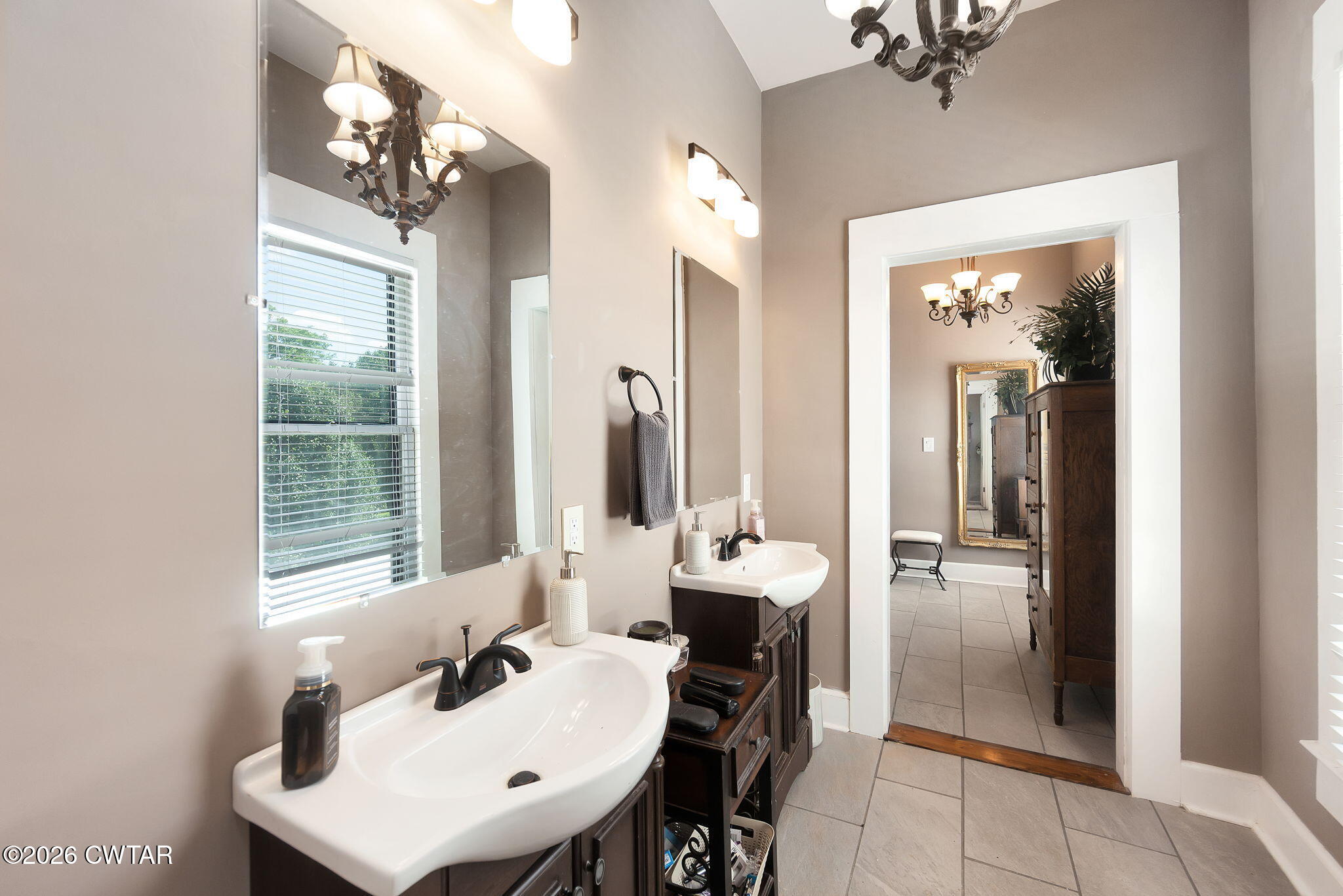 554 East Main Street Jackson, TN 38301 - Photo 31 of 60 a bathroom with a sink and a mirror