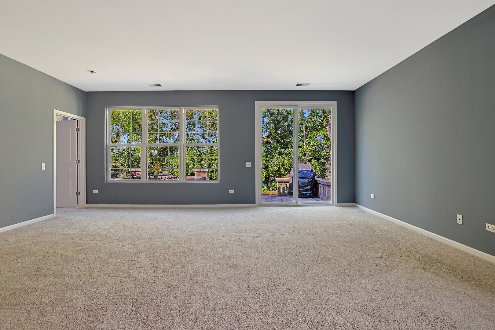 12669 Meritage Court Huntley, IL 60142 - Photo 11 of 33 a view of an empty room with windows and yard