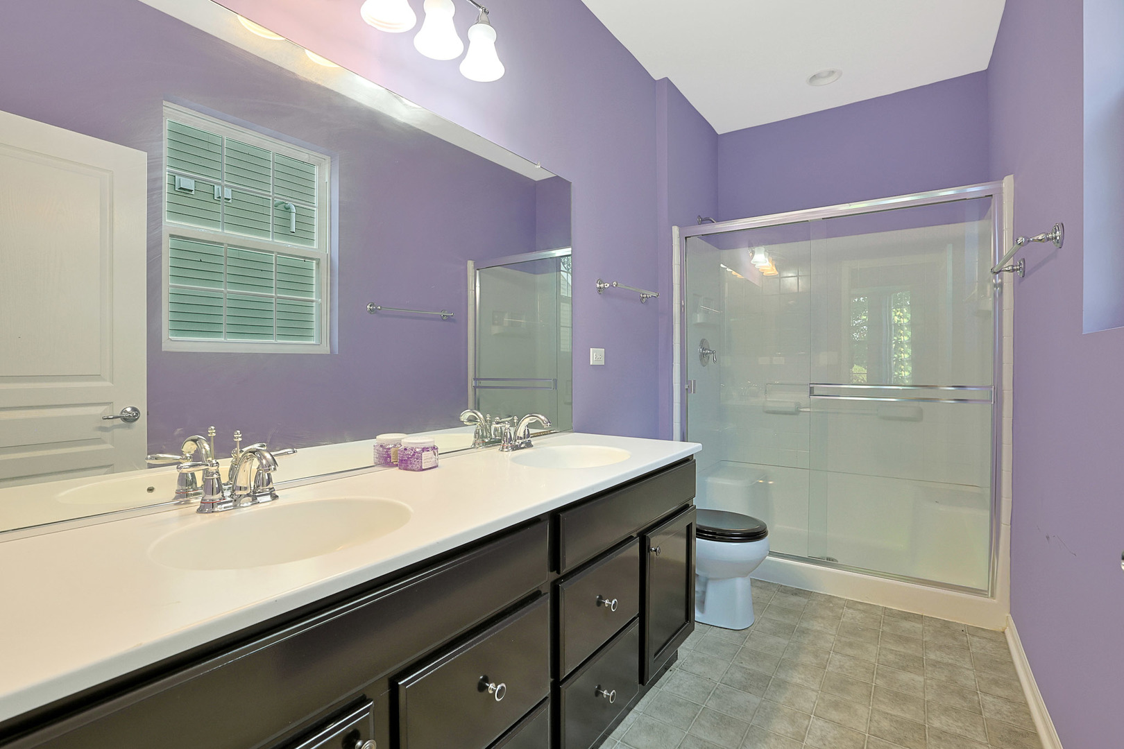 12669 Meritage Court Huntley, IL 60142 - Photo 17 of 33 a bathroom with a sink a toilet a shower and a large mirror