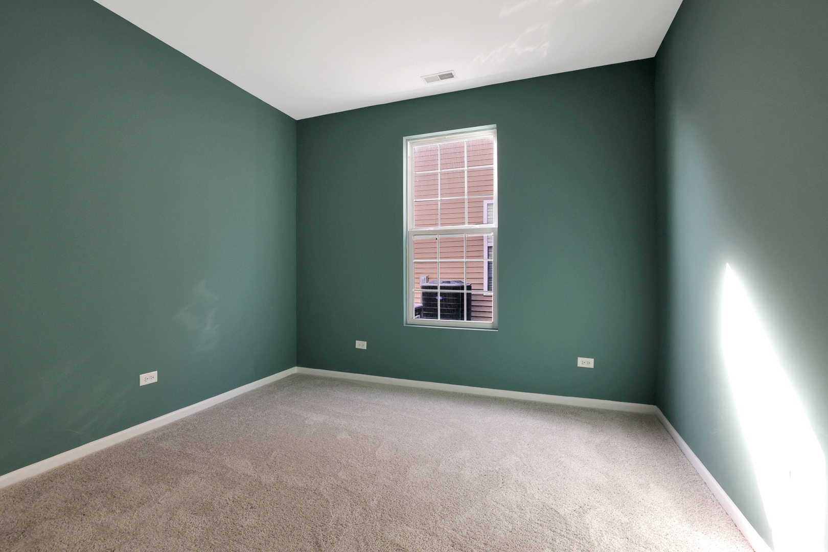 12669 Meritage Court Huntley, IL 60142 - Photo 20 of 33 an empty room with a window