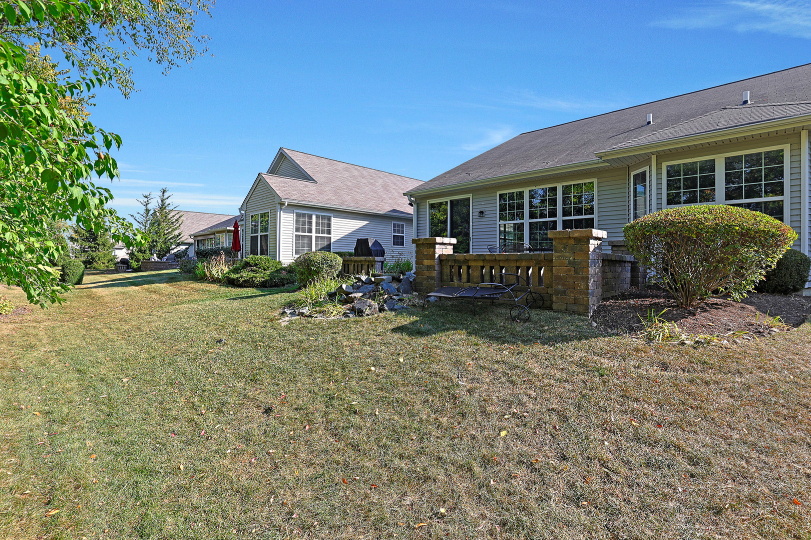 12669 Meritage Court Huntley, IL 60142 - Photo 23 of 33 a front view of a house with garden