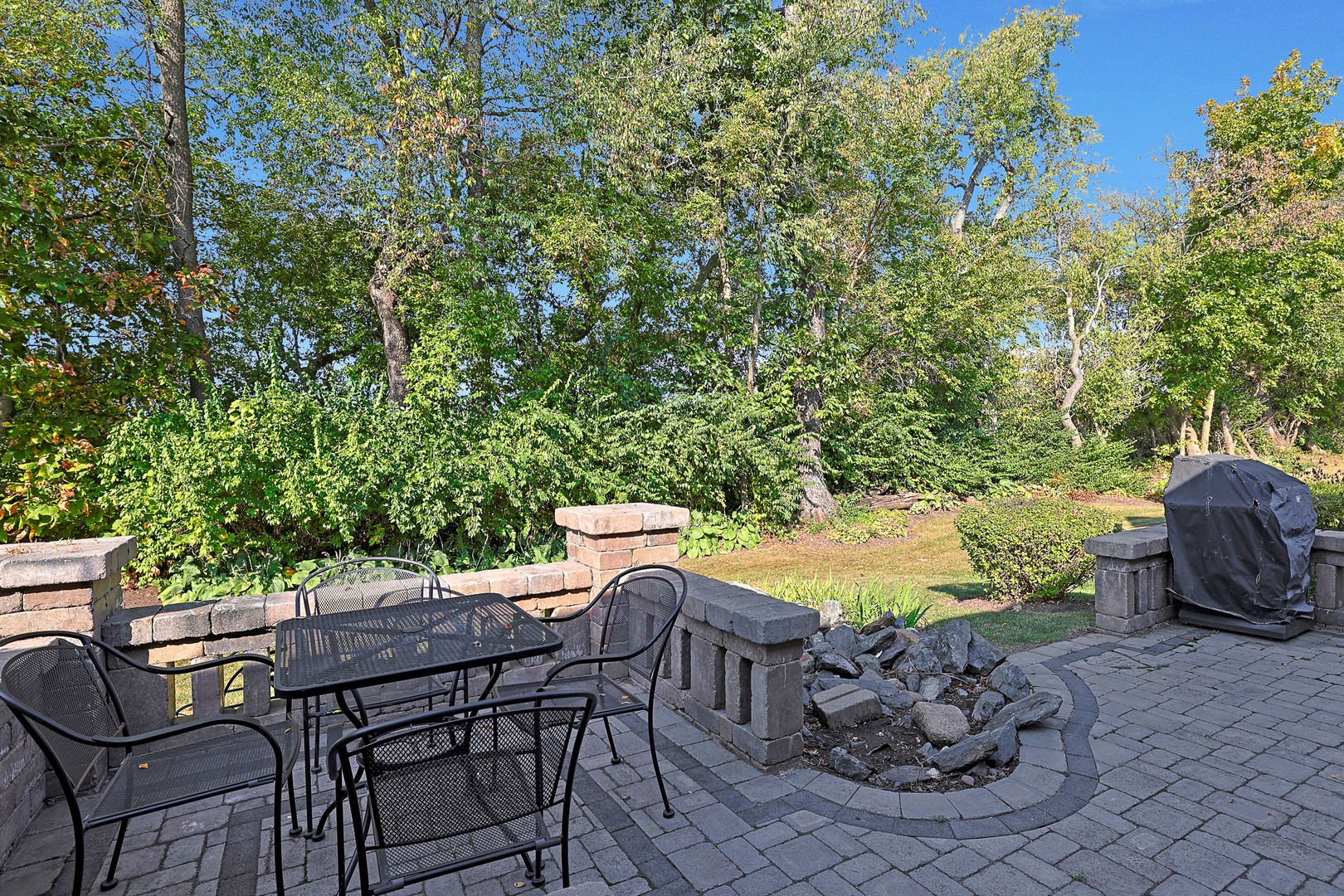 12669 Meritage Court Huntley, IL 60142 - Photo 26 of 33 a view of a patio with table and chairs and potted plants