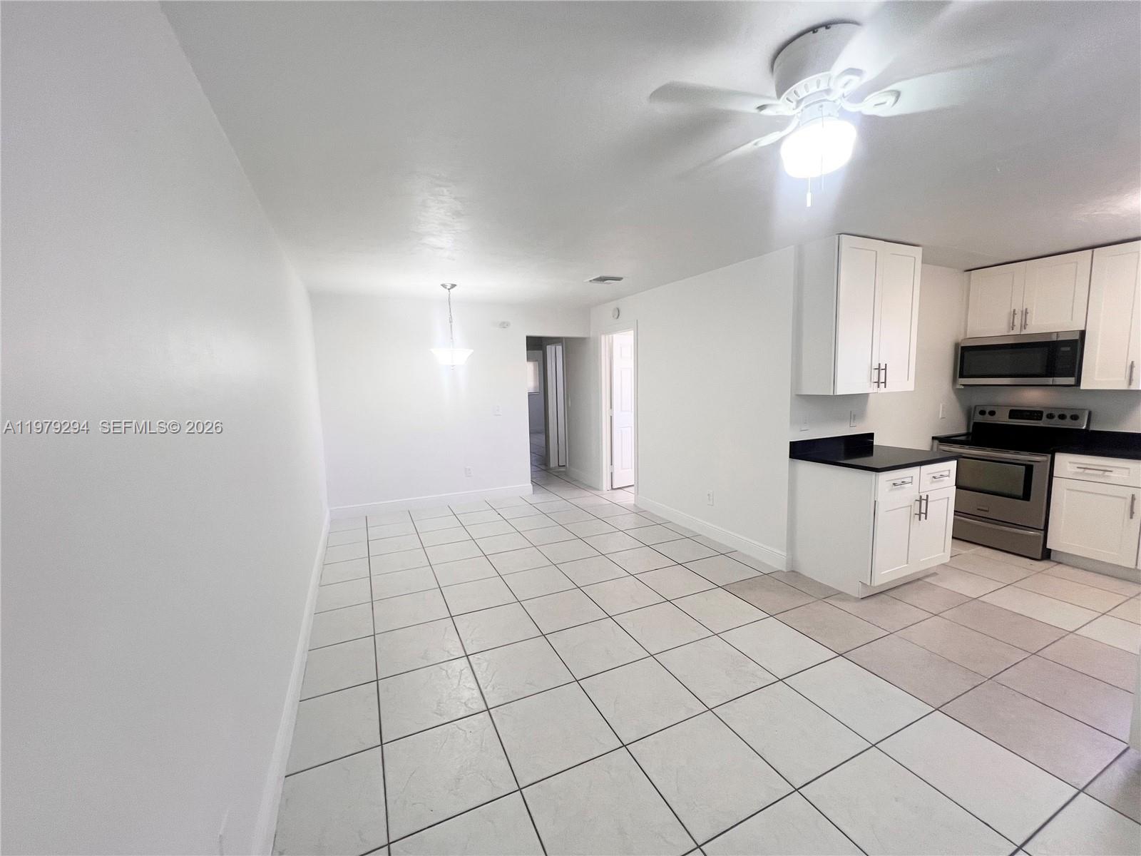 5600 Northwest 15th Street, Unit 9 Lauderhill, FL 33313 - Photo 2 of 7 a kitchen with stainless steel appliances a cabinets and a counter top