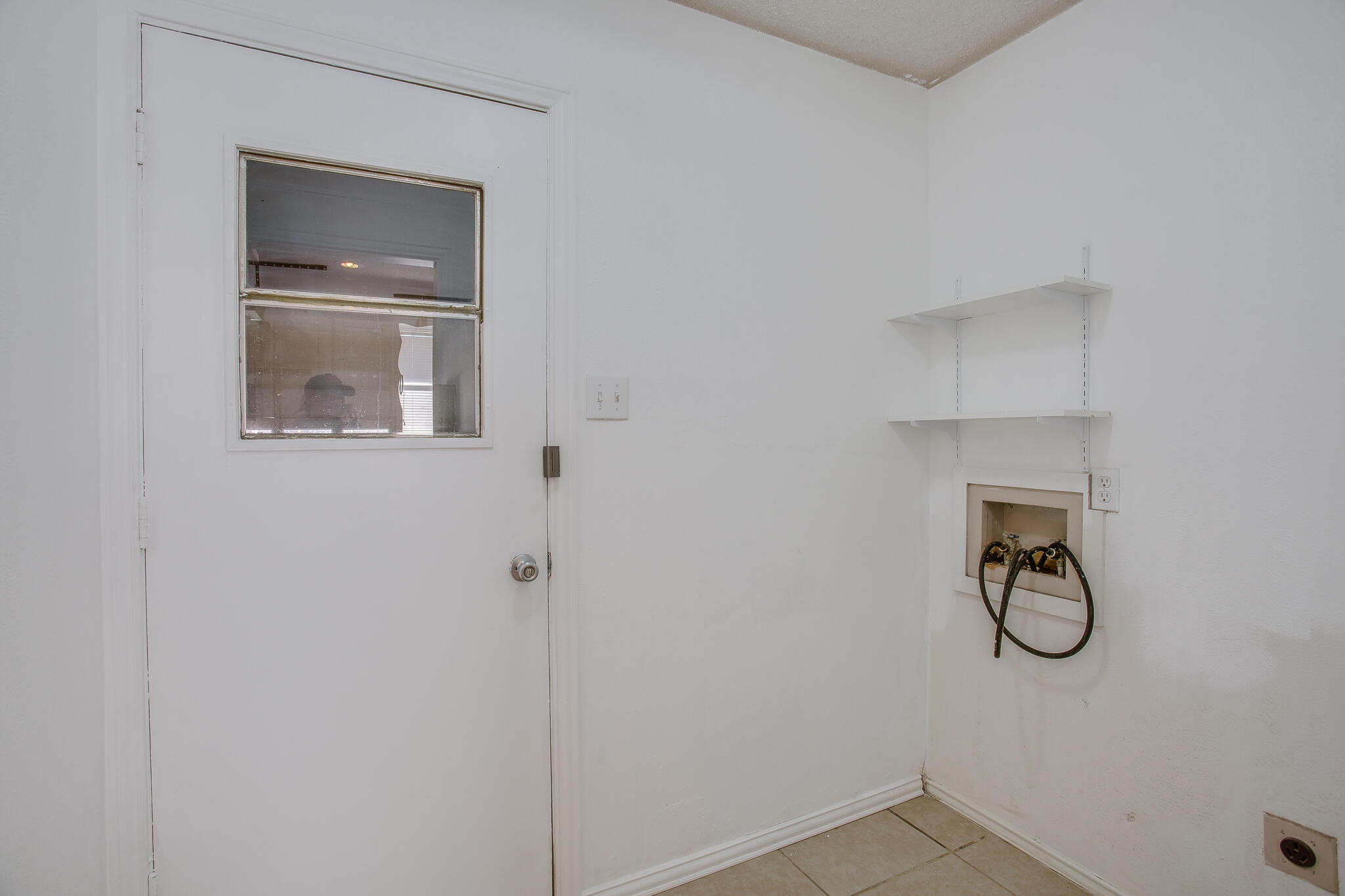 5613 16th Place Lubbock, TX 79416 - Photo 13 of 14 a bathroom with a bathtub