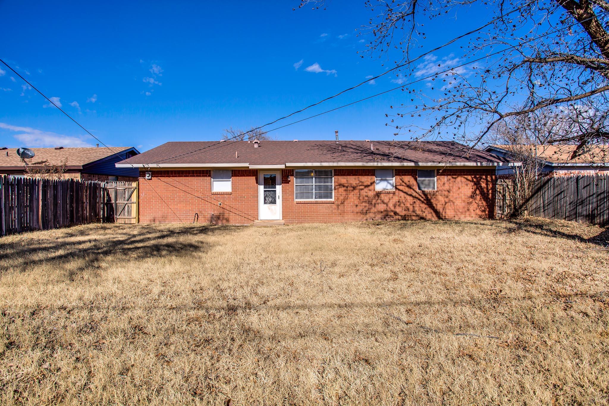 5613 16th Place Lubbock, TX 79416 - Photo 14 of 14 a view of a house with a yard
