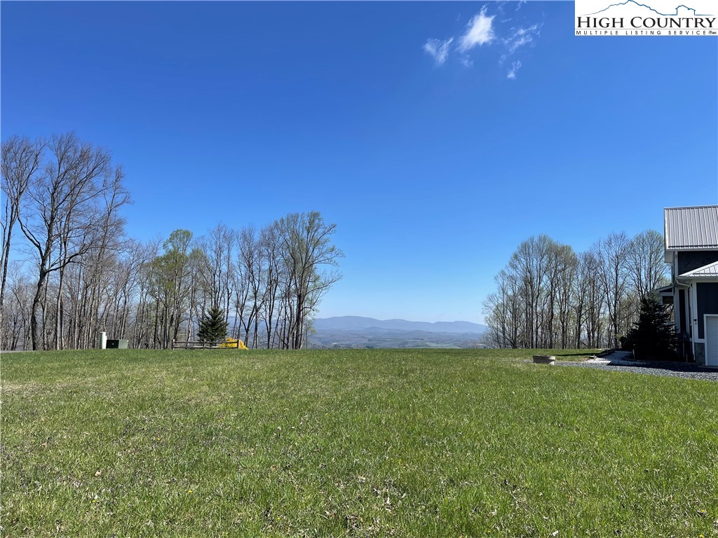 Lot#14 Olde Stone Ridge Lansing, NC 28643 - Photo 2 of 19 a view of a yard with a house in the background