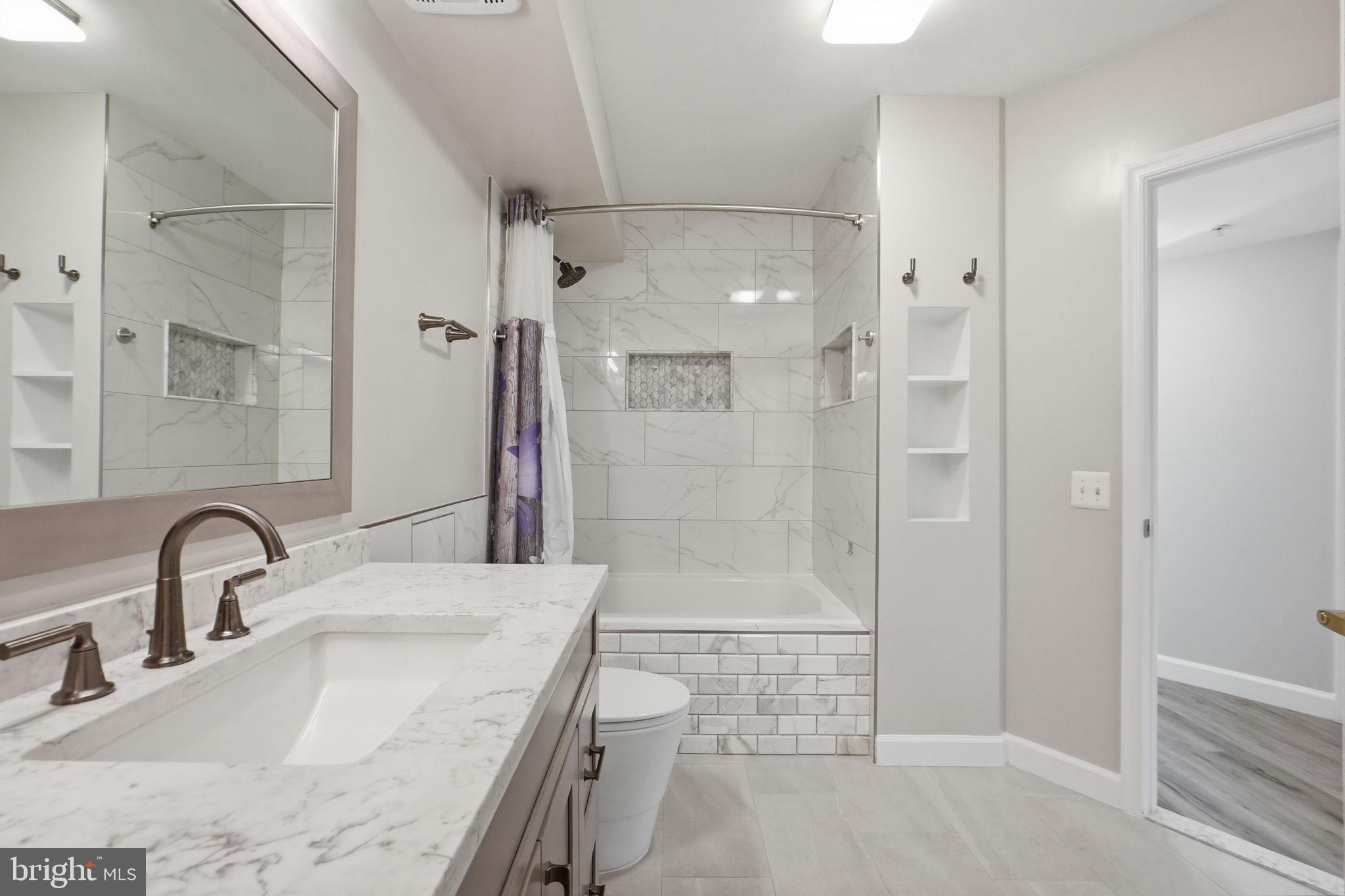 631 D Street Northwest, Unit 633 Washington, DC 20004 - Photo 22 of 40 Dual shower niches, new vanity and toilet