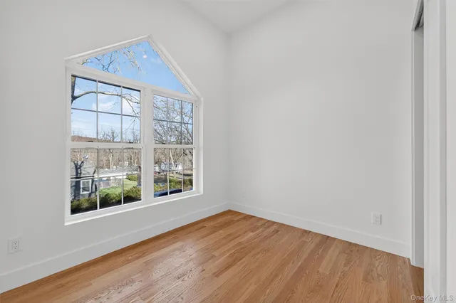 a view of empty room with windows