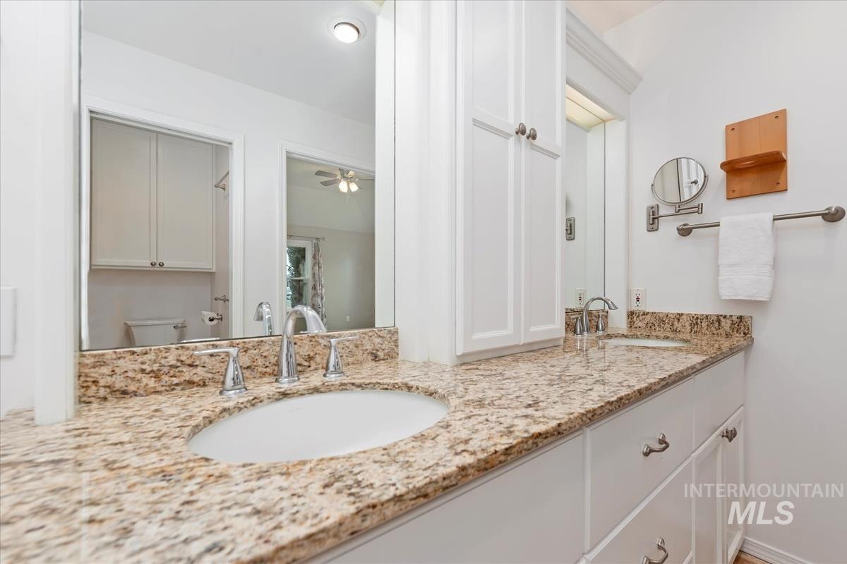 7790 Ustick Road Nampa, ID 83687 - Photo 18 of 41 Full bathroom with double vanity and a ceiling fan