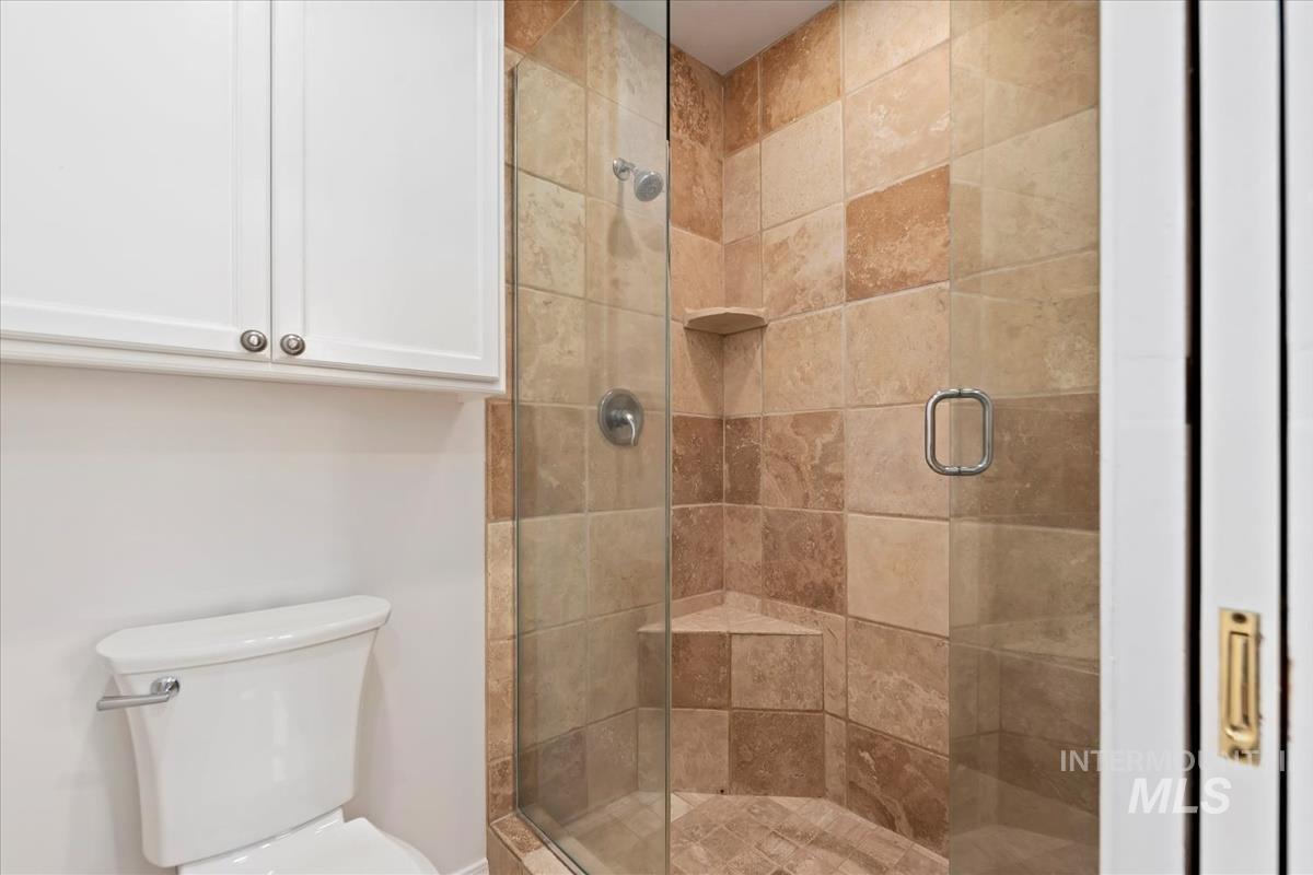 7790 Ustick Road Nampa, ID 83687 - Photo 19 of 41 Full bathroom featuring a stall shower and toilet