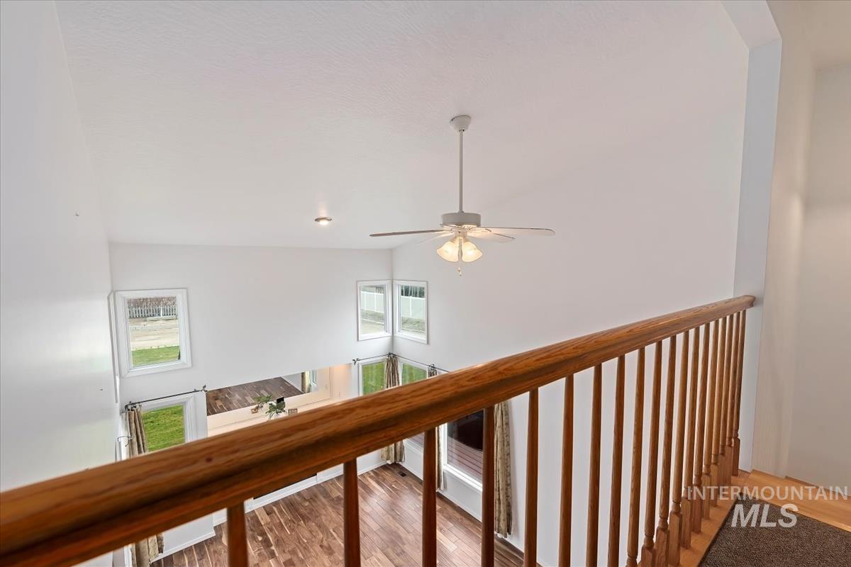 7790 Ustick Road Nampa, ID 83687 - Photo 20 of 41 Hall with light wood-style floors, healthy amount of natural light, and a towering ceiling