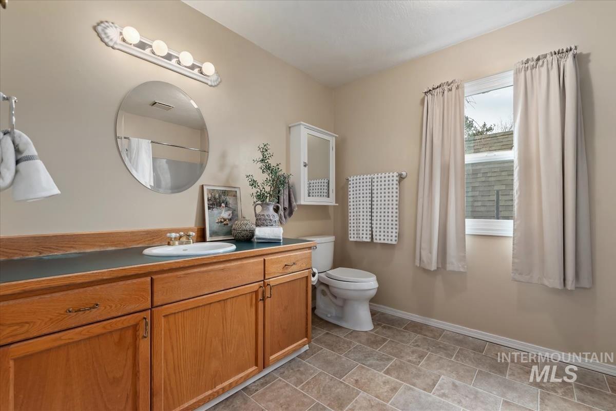 7790 Ustick Road Nampa, ID 83687 - Photo 22 of 41 Bathroom featuring vanity and a shower with shower curtain