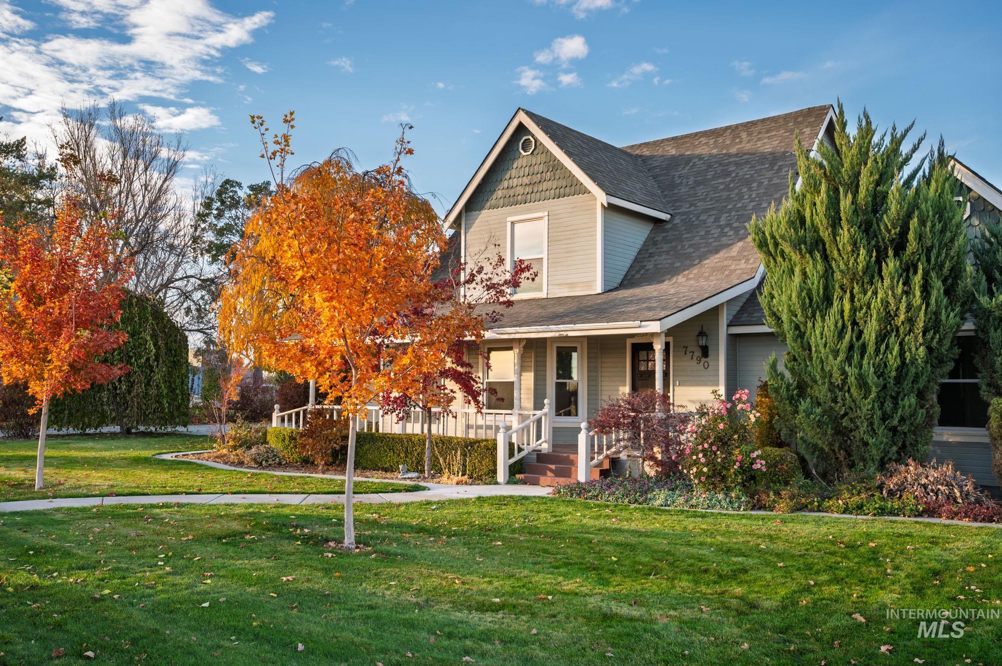 7790 Ustick Road Nampa, ID 83687 - Photo 36 of 41 View of front facade featuring a front yard, a porch, and roof with shingles