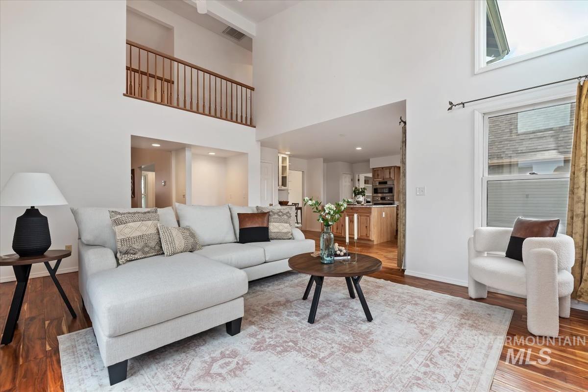 7790 Ustick Road Nampa, ID 83687 - Photo 6 of 41 Living area featuring wood finished floors and a towering ceiling
