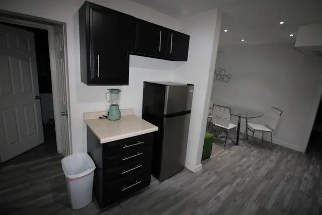 a bathroom with a sink toilet a mirror and vanity