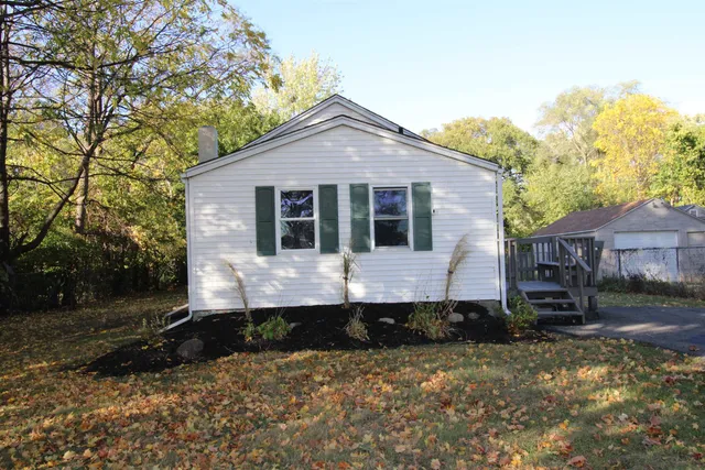 a house view with a backyard space