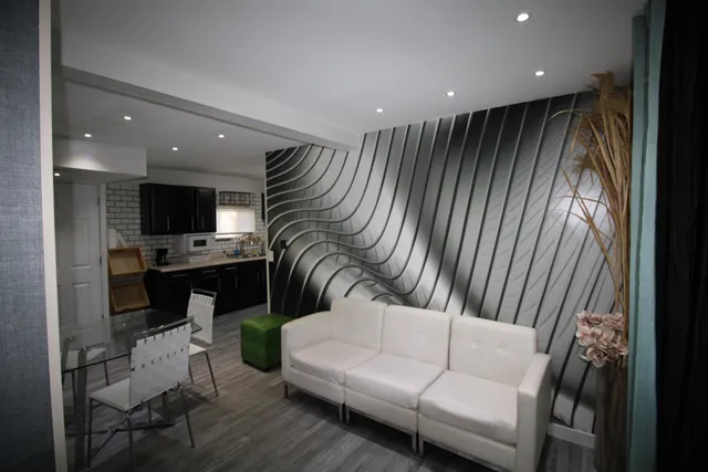 a living room with furniture and a flat screen tv