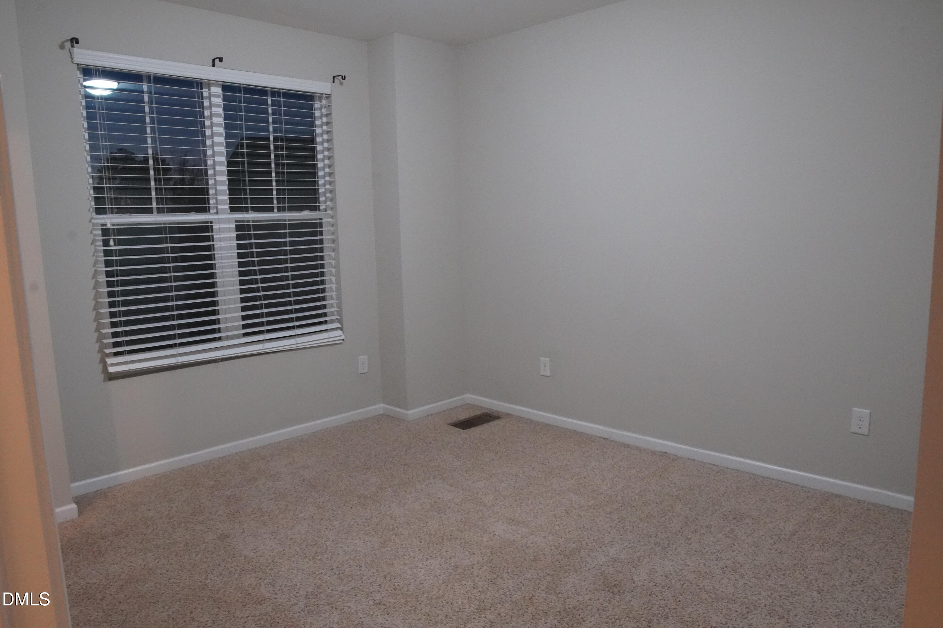4039 Sykes Street Cary, NC 27519 - Photo 13 of 22 a view of empty room with windows