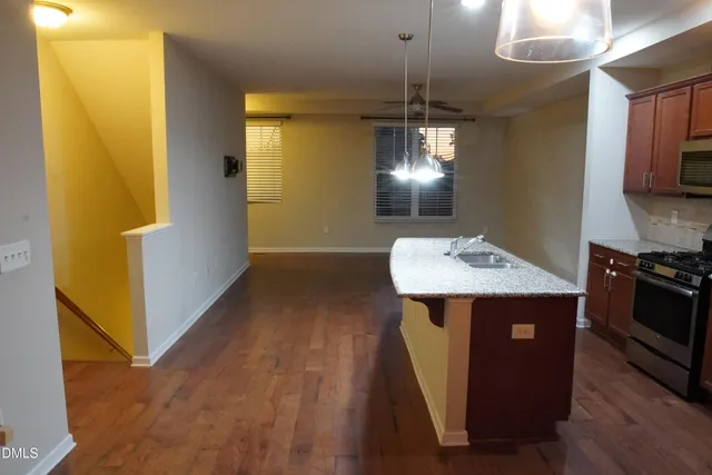 a view of room with window and hardwood floor