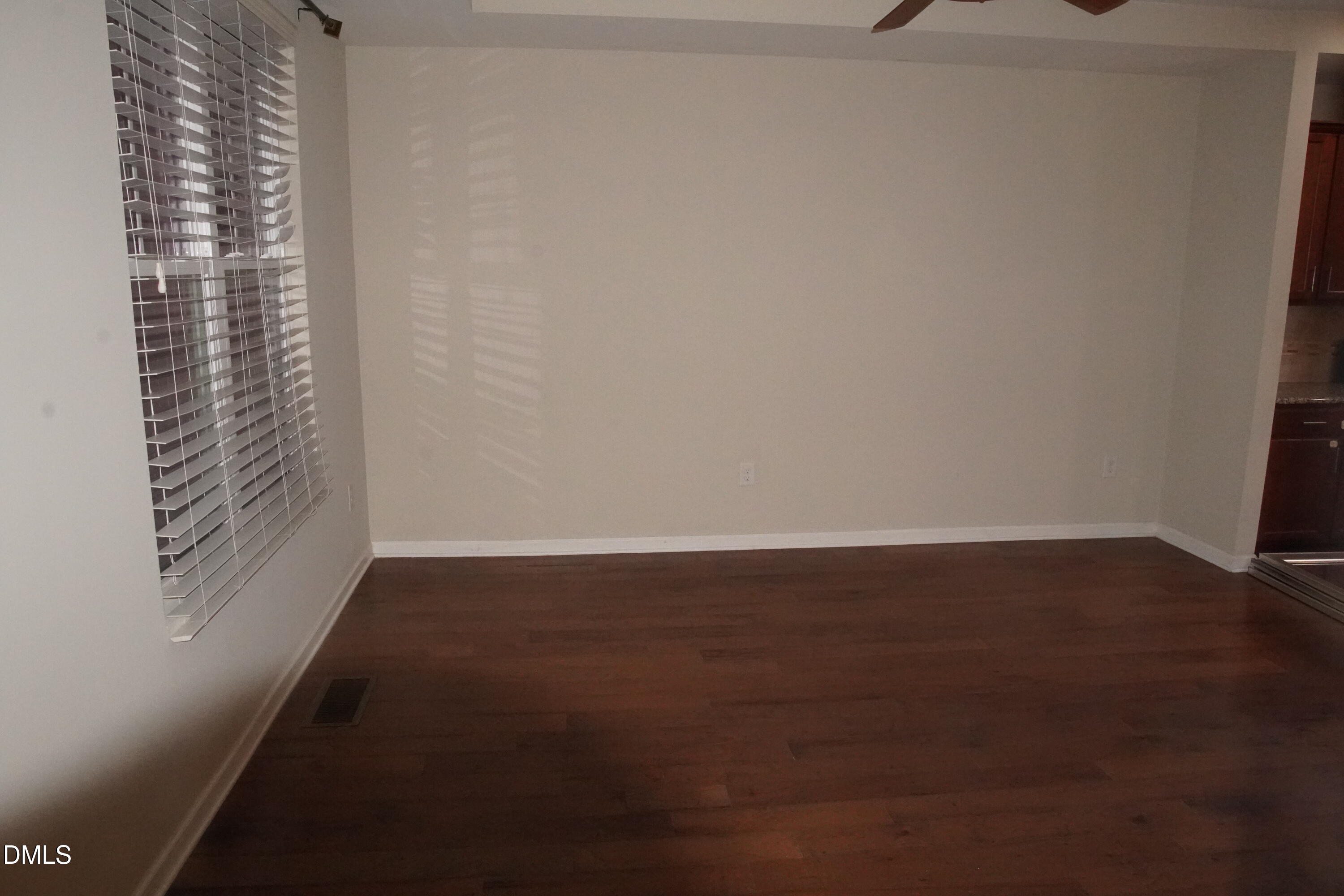 4039 Sykes Street Cary, NC 27519 - Photo 9 of 22 a view of room with window and hardwood floor