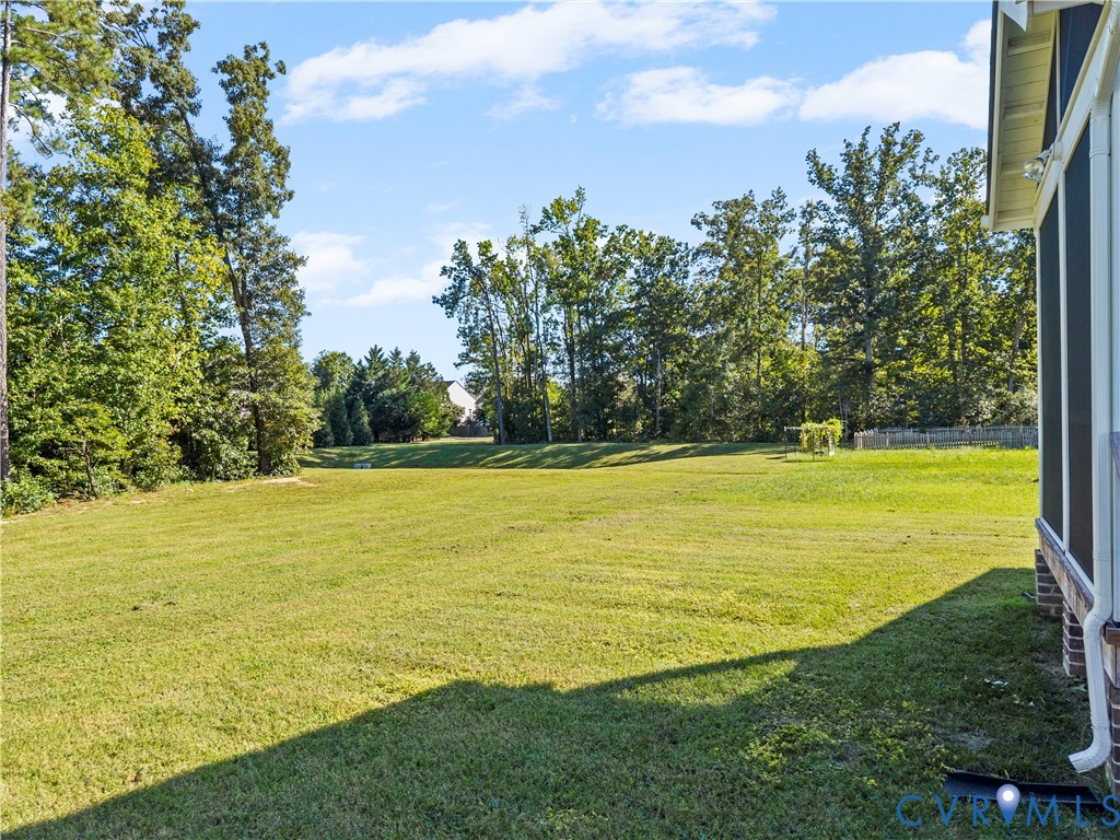 8819 Roberta Road Mechanicsville, VA 23116 - Photo 63 of 79 Expansive grassy yard framed by mature trees, feat