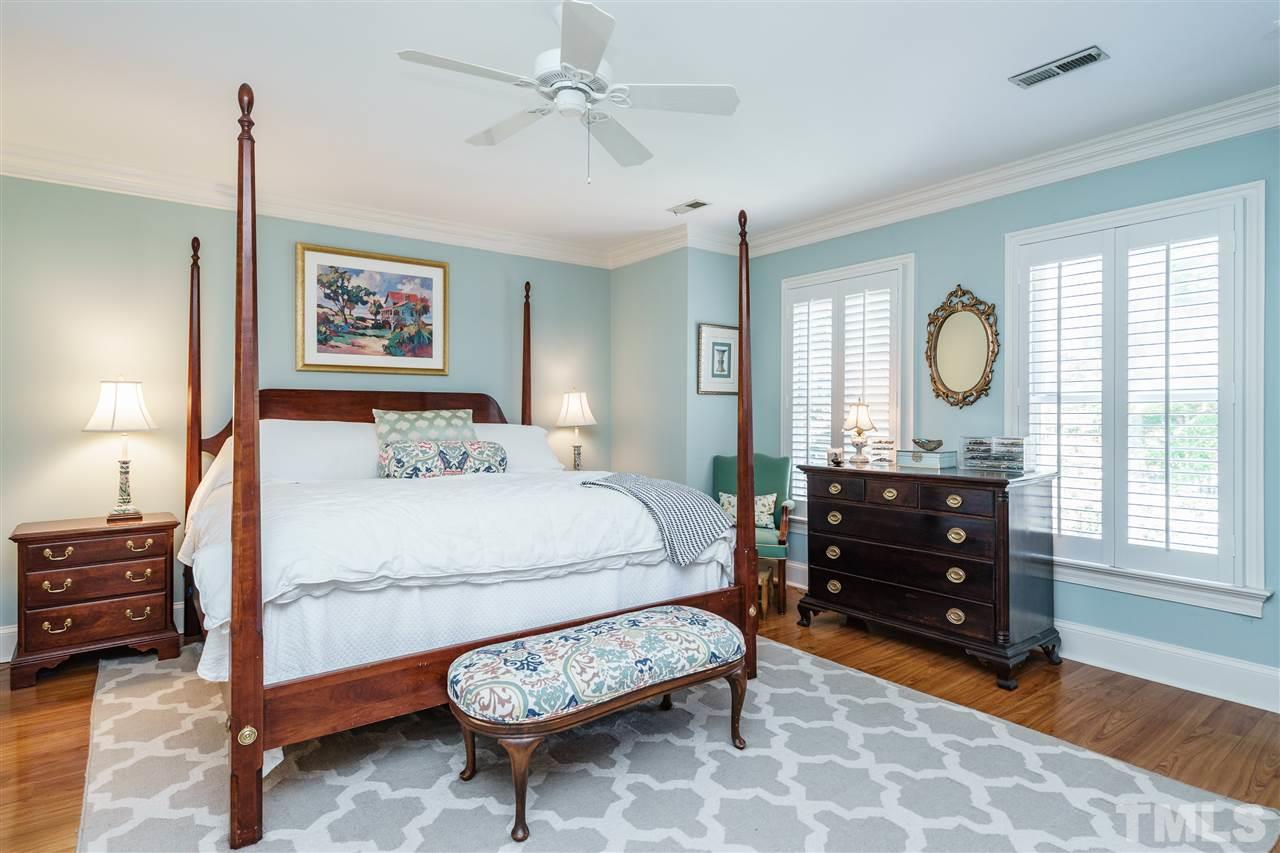 3320 Ridgecrest Court Raleigh, NC 27607 - Photo 16 of 24 a bedroom with a bed dresser and a window