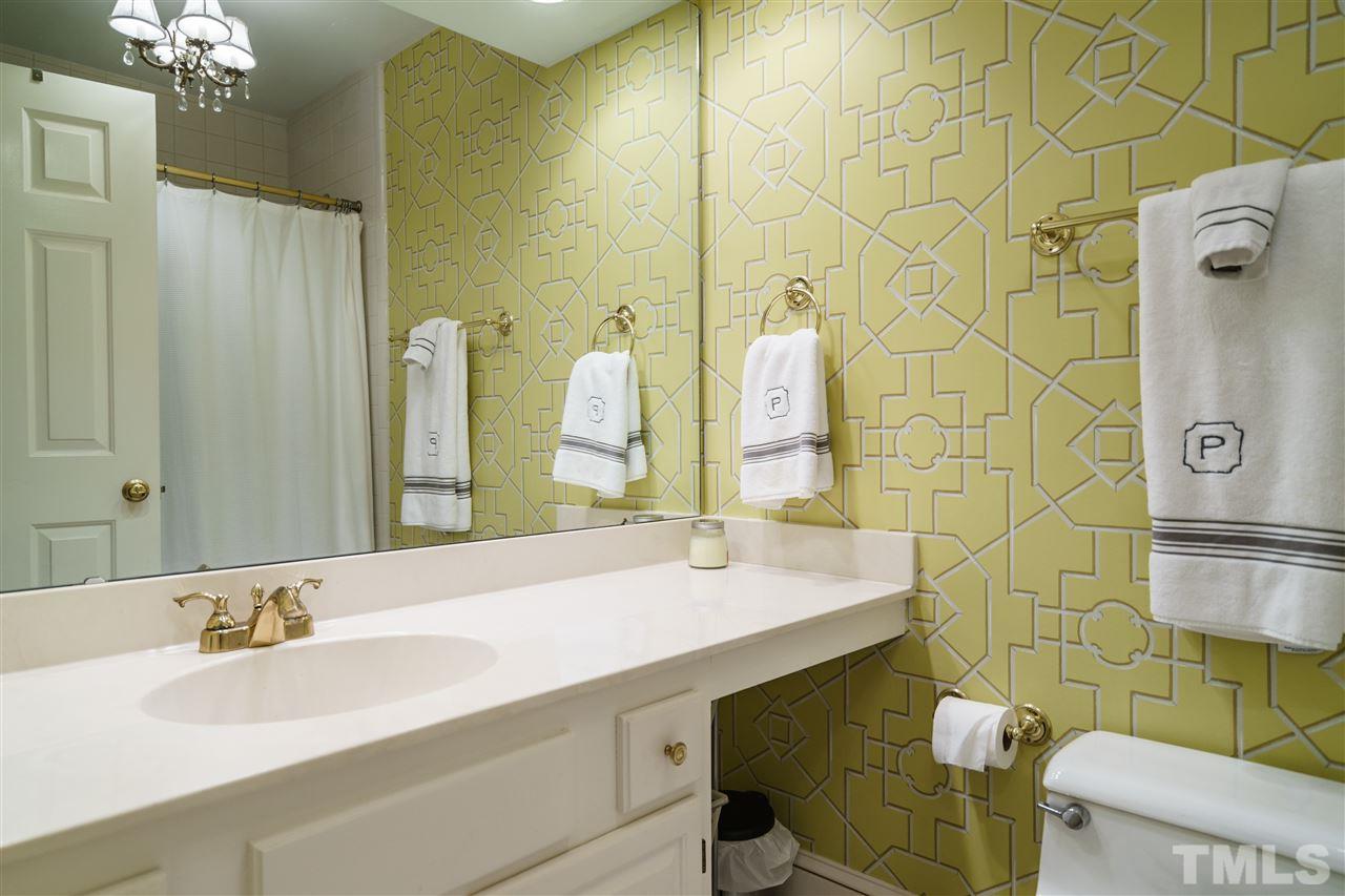 3320 Ridgecrest Court Raleigh, NC 27607 - Photo 20 of 24 a bathroom with a sink mirror and toilet