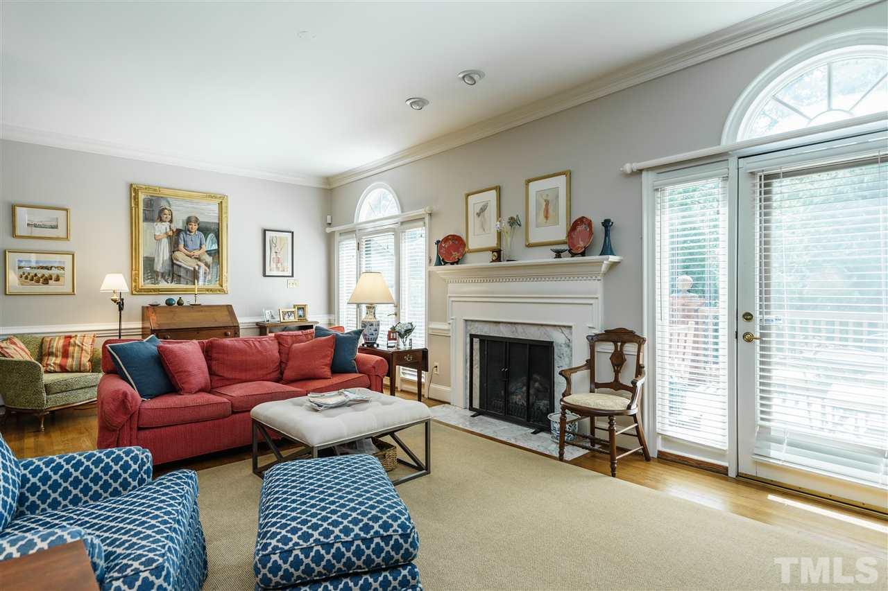 3320 Ridgecrest Court Raleigh, NC 27607 - Photo 7 of 24 a living room with furniture and a fireplace