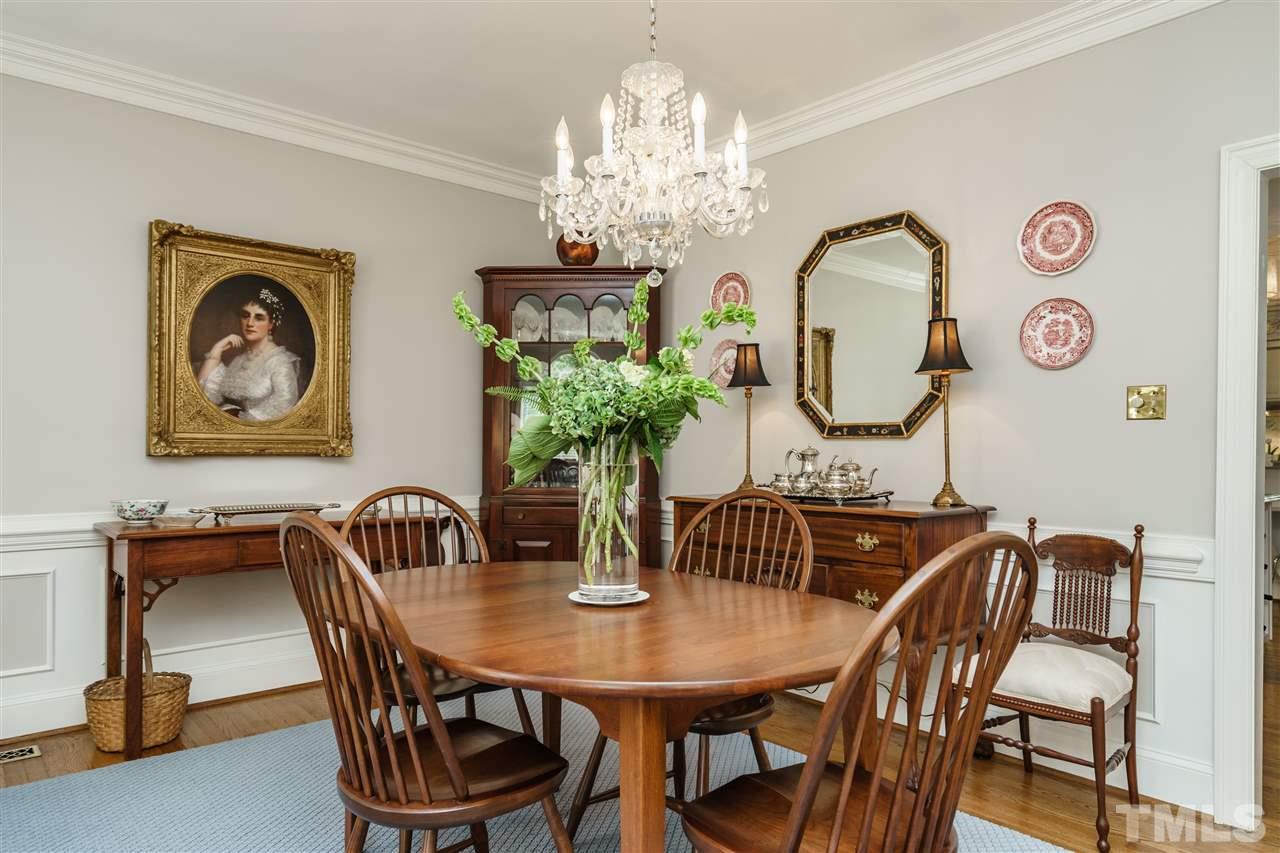 3320 Ridgecrest Court Raleigh, NC 27607 - Photo 9 of 24 a view of a dining room with furniture and a chandelier
