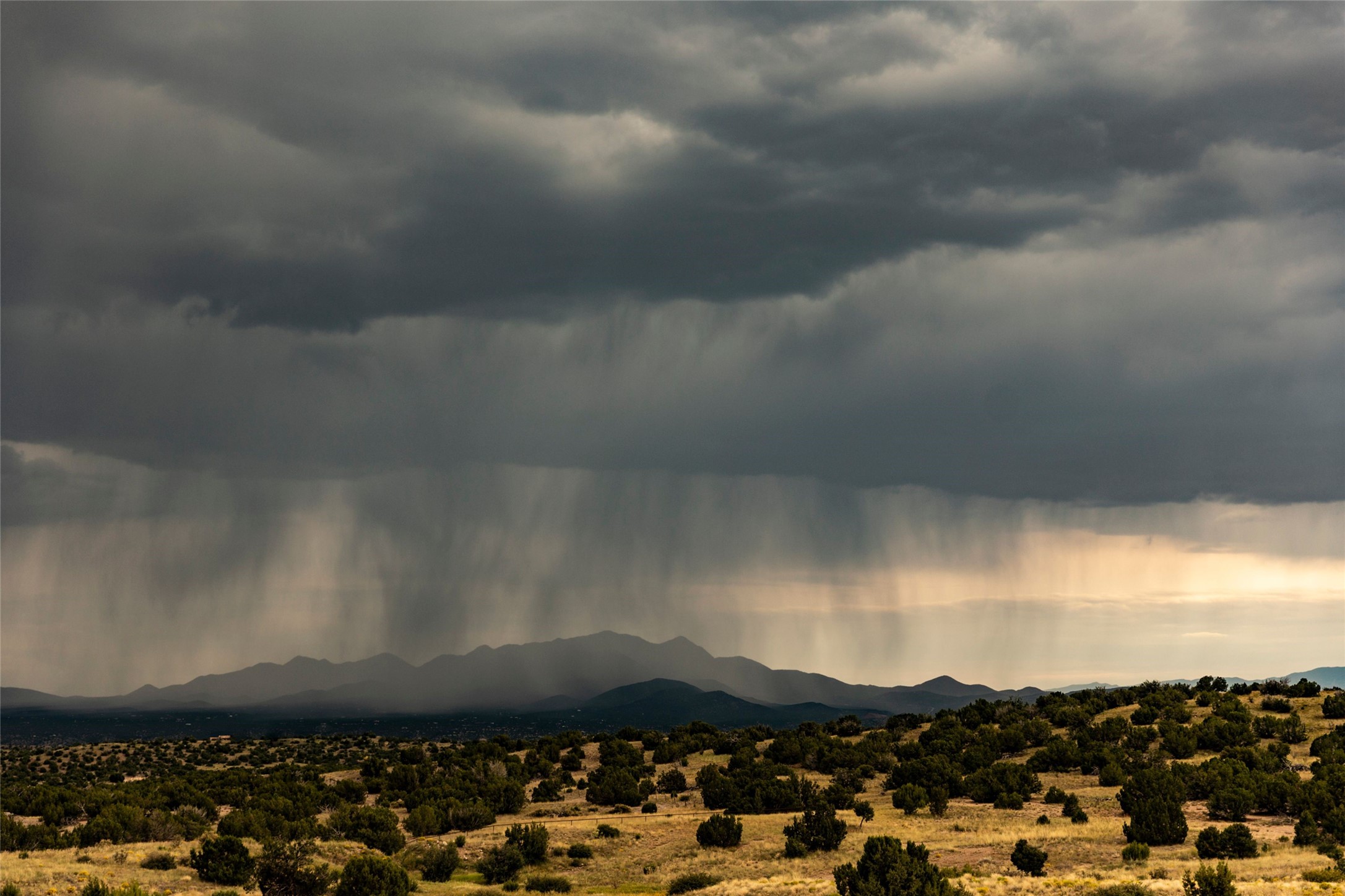 37 Rancho Alegre Road Santa Fe, NM 87508 - Photo 66 of 69 Rainfall Over the Ortiz Mountains
