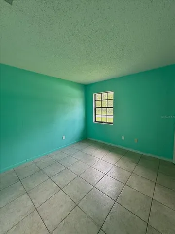 a view of an empty room with windows