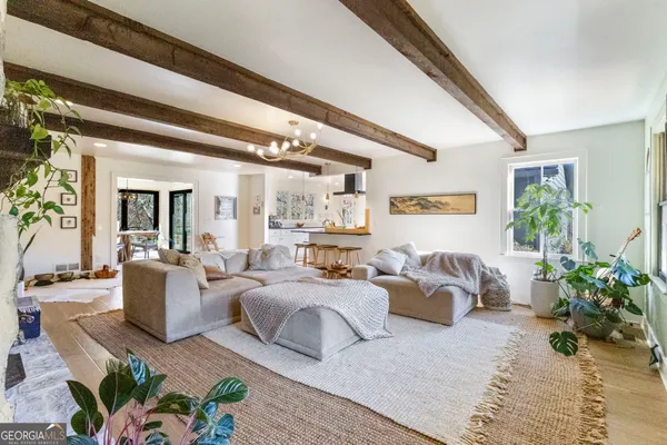 a bedroom with furniture and a potted plant
