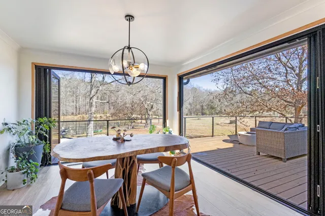 a view of a dining room with furniture window and outside view