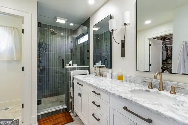 a white toilet sitting next to a white walls