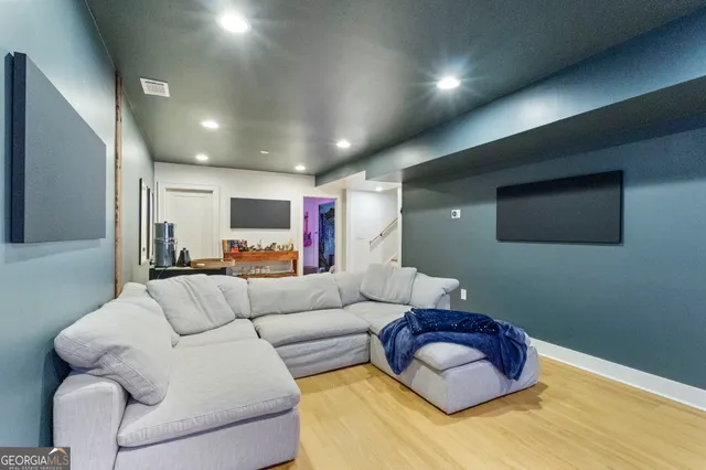 a living room with furniture toys and a chandelier