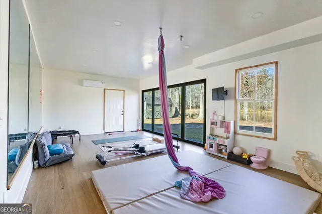 a outdoor living space with patio furniture and wooden floor