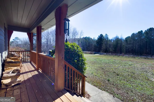 a view of a pathway of a house with wooden floor