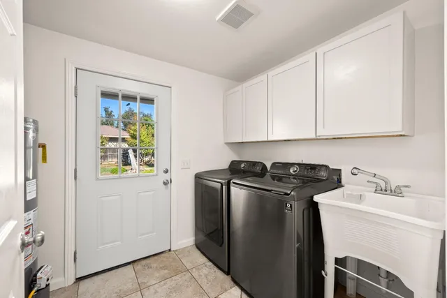 a view of a refrigerator and window in a kitchen
