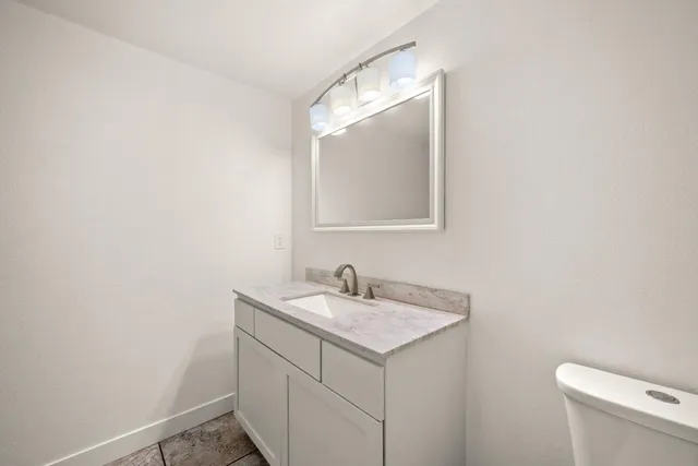 a bathroom with a sink and a toilet
