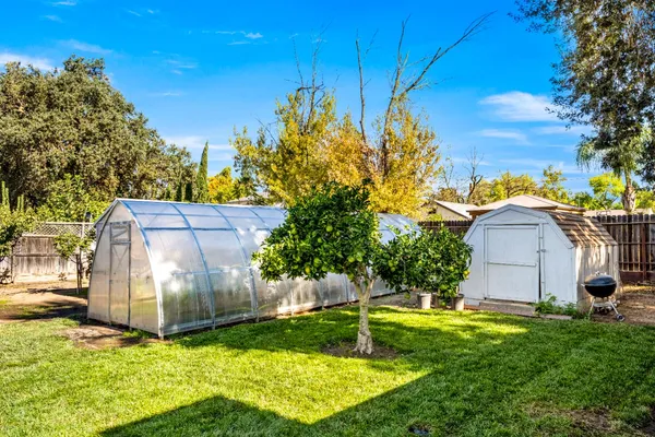 a backyard of a house with lots of green space