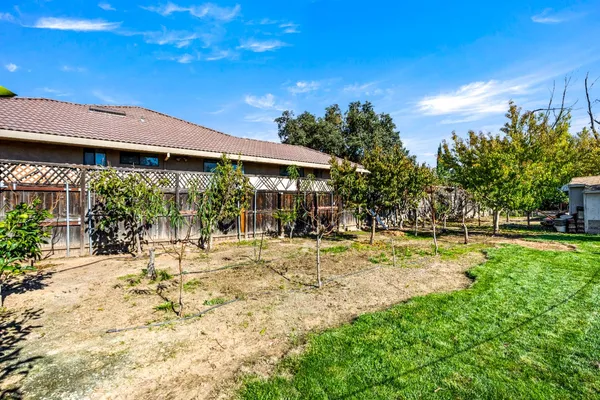a view of a house with swimming pool and sitting area