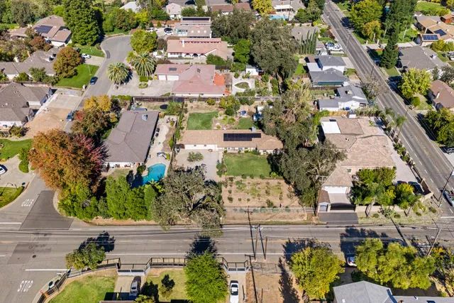 an aerial view of a houses with outdoor space