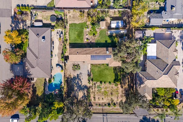 a aerial view of a house with a yard