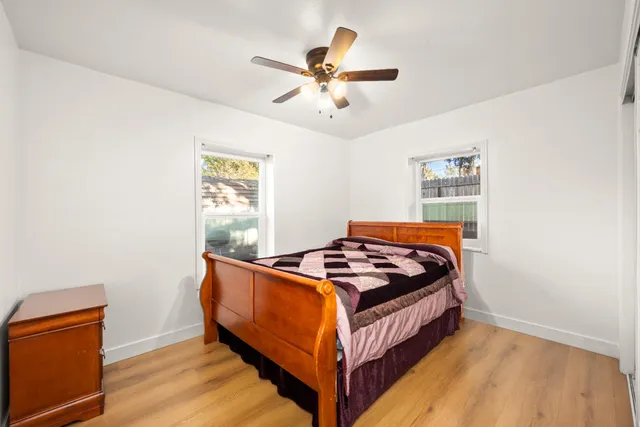 a bedroom with a bed and window