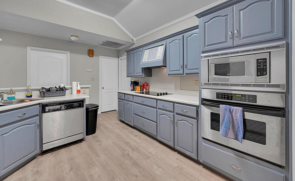 2618 South 2nd Street Waco, TX 76706 - Photo 11 of 40 a kitchen with stainless steel appliances granite countertop a stove a sink and a microwave