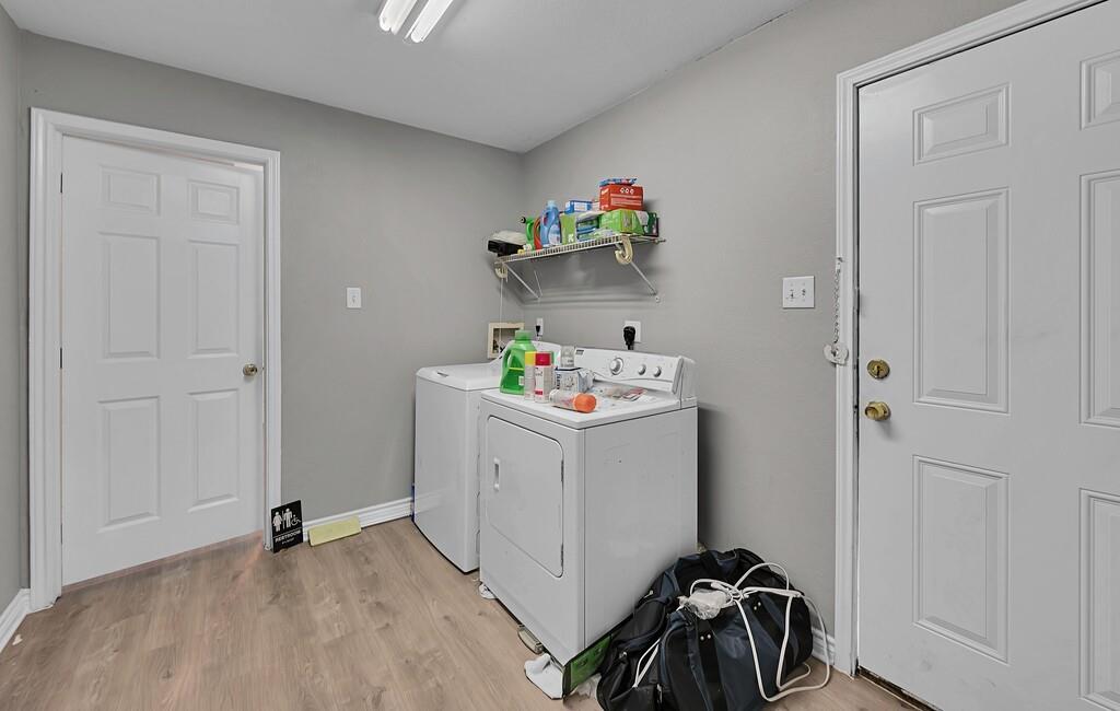 2618 South 2nd Street Waco, TX 76706 - Photo 21 of 40 a storage room with wooden floor washer and dryer