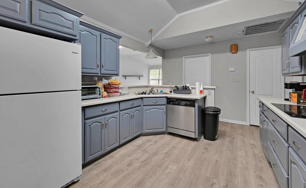 2618 South 2nd Street Waco, TX 76706 - Photo 10 of 40 a kitchen with a sink a stove a refrigerator and cabinets