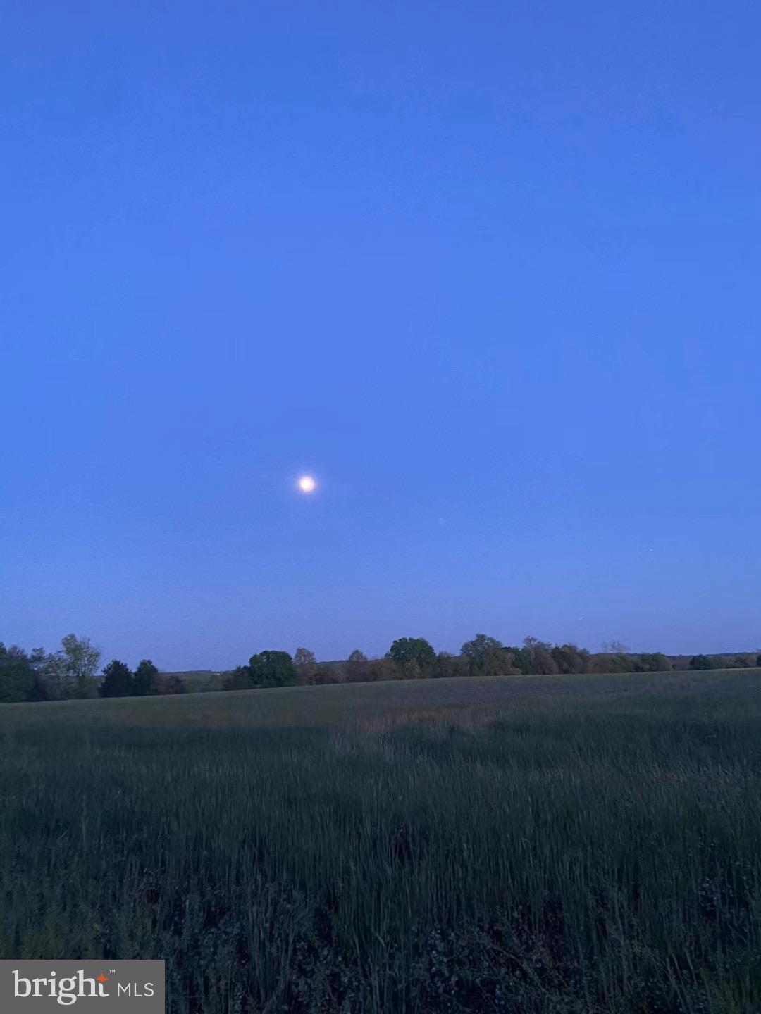 a view of mountain and sunset