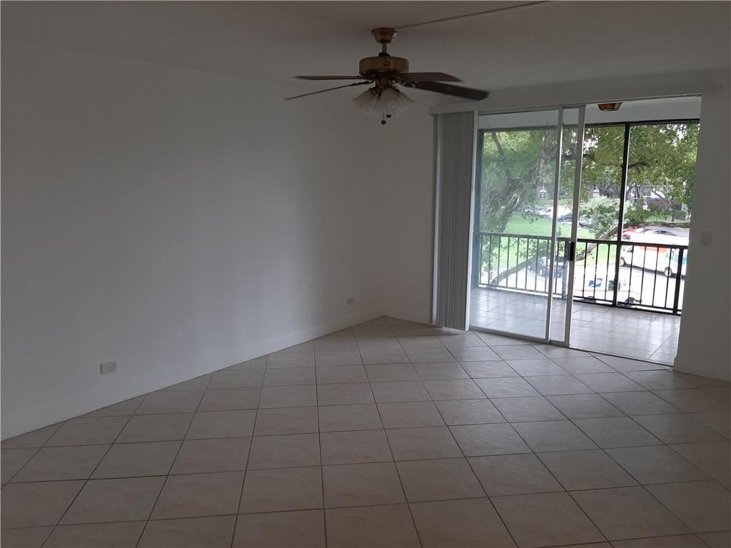 3650 Inverrary Drive, Unit 3Q Lauderhill, FL 33319 - Photo 3 of 16 a view of an empty room with a window